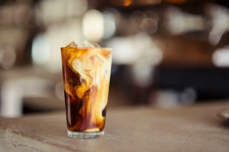 An iced batch brew over ice in a tall glass